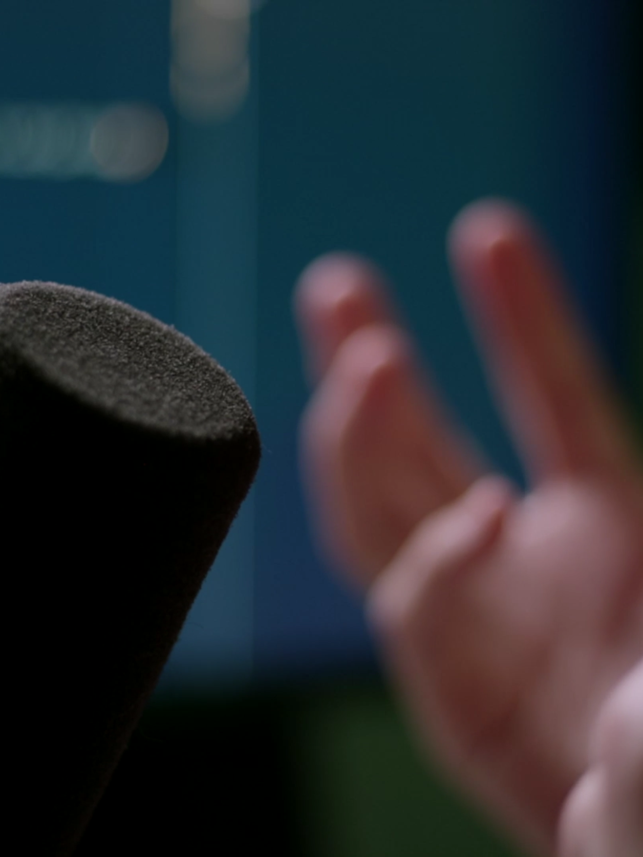 A microphone and hands