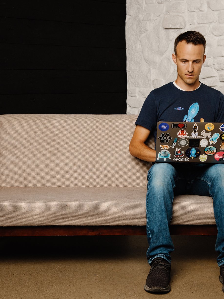 Kent coding on a couch