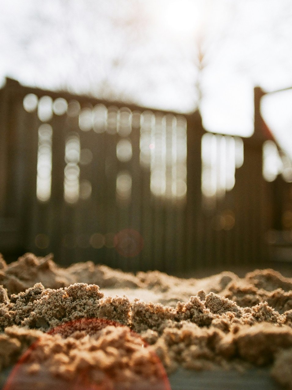 A pile of sand sitting on top of a sidewalk