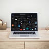MacBook Pro on top of brown table