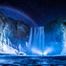 person in front of waterfalls during nighttime